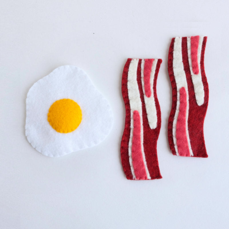 Felt sunny side eggs and bacon